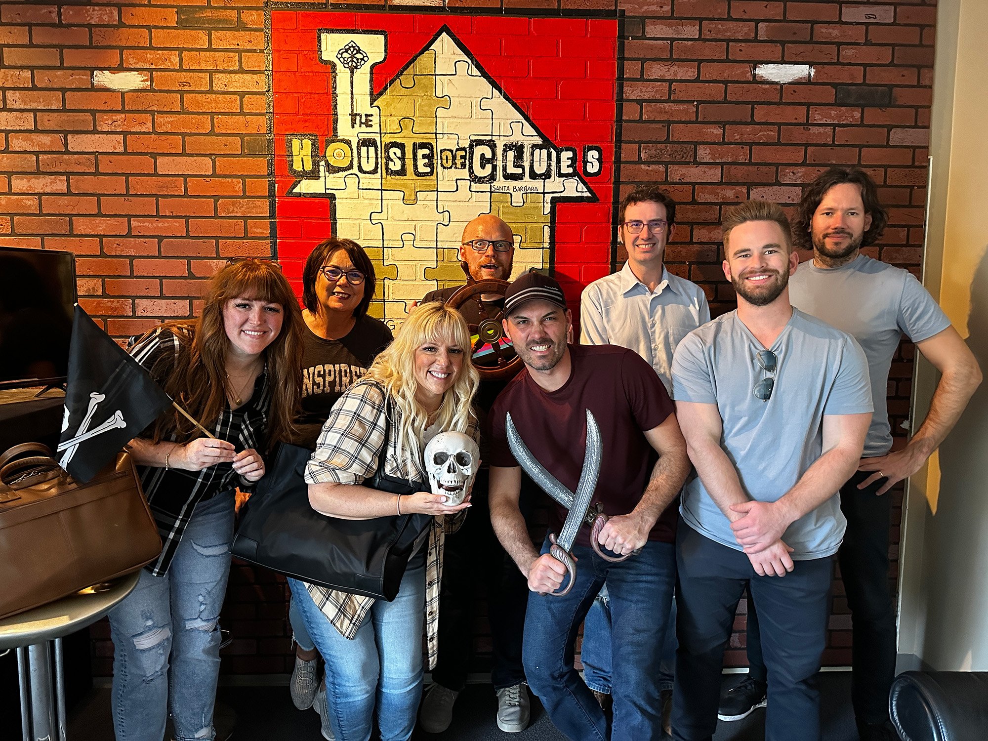 Photo of a group of men and women posing and smiling